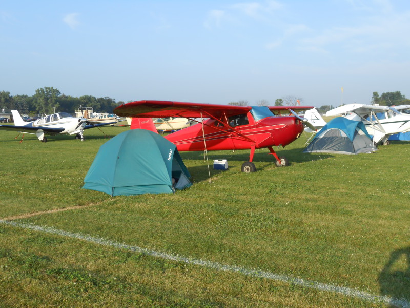 Image of C140 Redbird camping at Oshkosh Fly-In